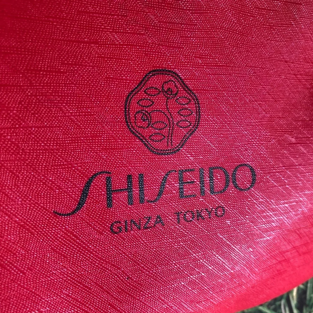 Shiseido Ginza Tokyo Red Makeup Bag with .33 oz Ultimune Deluxe Sample Included